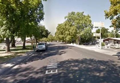 One unidentified person was hurt after a two-vehicle collision resulted in one of the cars crashing into a building in Tustin
