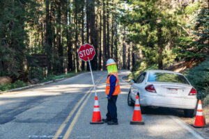traffic-safety-officer-putting-up-signages