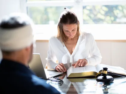 A lawyer discussing with a client about the accident claim