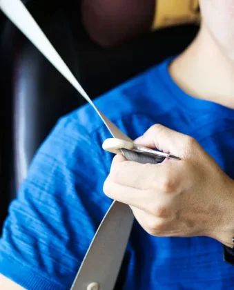 close up view of man using seatbelt