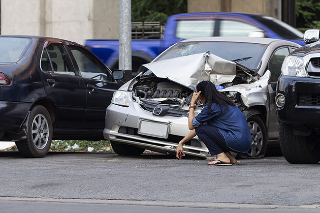 Car accident victim in Santa Monica checking the damages