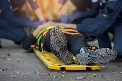 Emergency responders assisting a severely injured Lyft accident victim