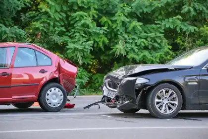 Rear-end collision between a black car and a red car