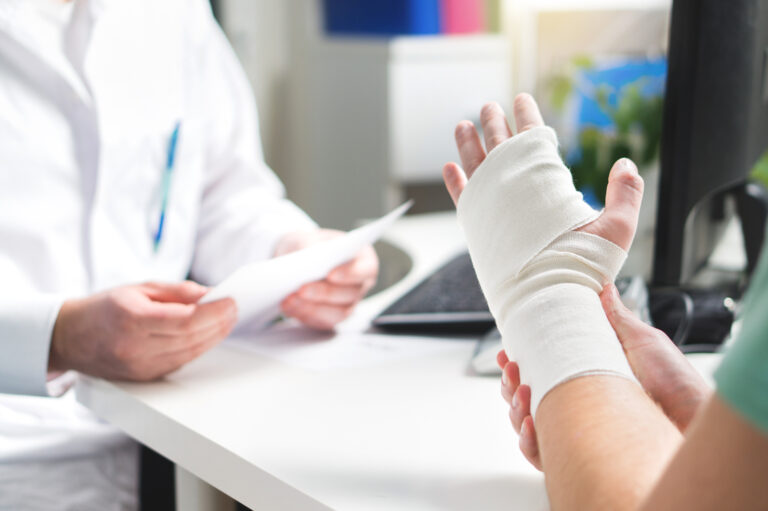 Patient with hand injury consulting a doctor after an accident in Lodi