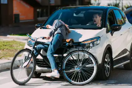 Car Hitting a Bicycle at an Intersection