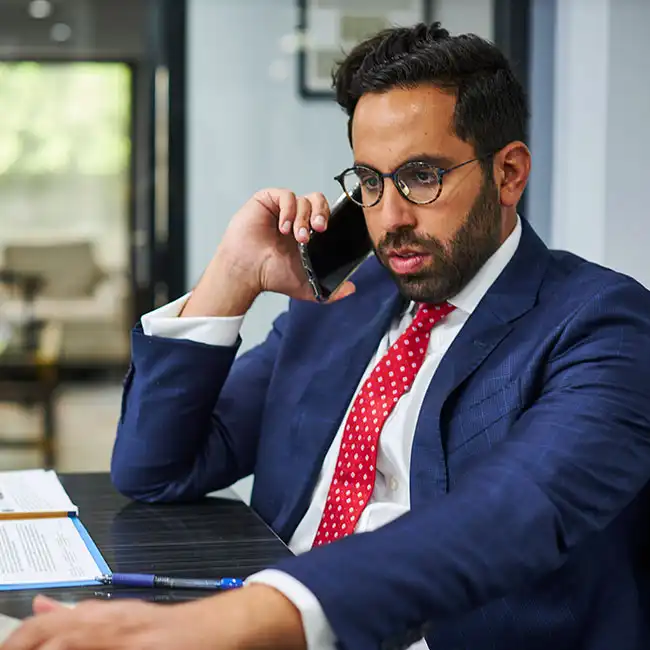AK Lawyer speaking with a car accident victim via phone
