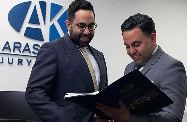 AK lawyers reviewing a car accident case in Elk Grove