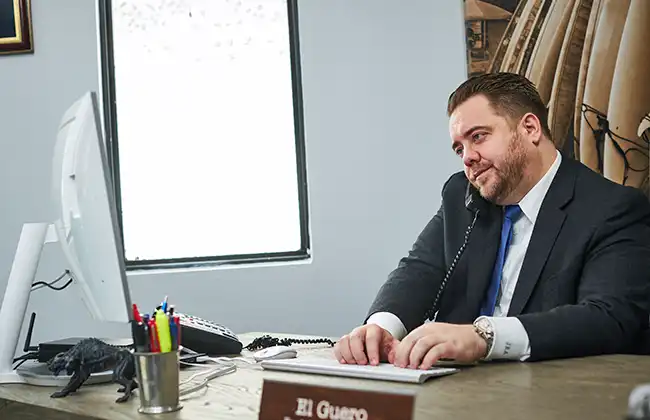 Car accident lawyer answering client questions over the phone in El Dorado County