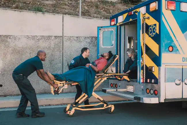 Injured victim on a stretcher after a roofing accident