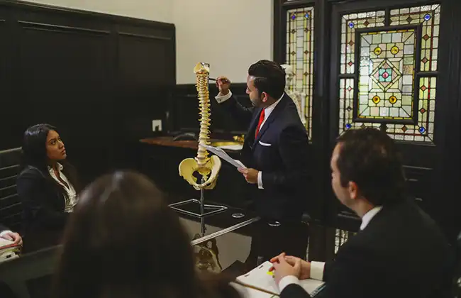 Oceanside personal injury lawyers discussing a spinal injury case
