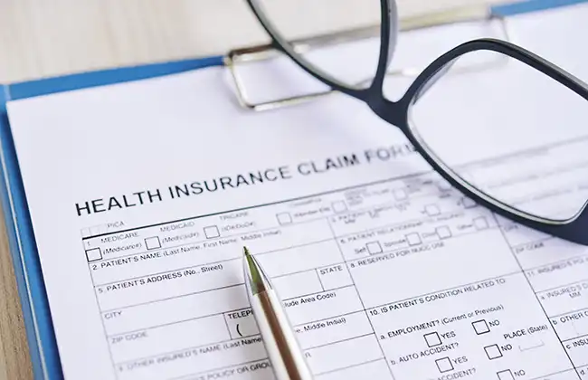 Filling out an insurance claim form for burn injuries