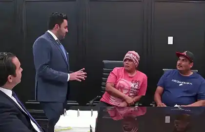 Rideshare accident victims consulting with a lawyer about suing Uber or Lyft after a crash