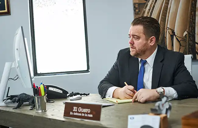 AK Lawyer in Stockton reviewing a dog bite injury case at his desk