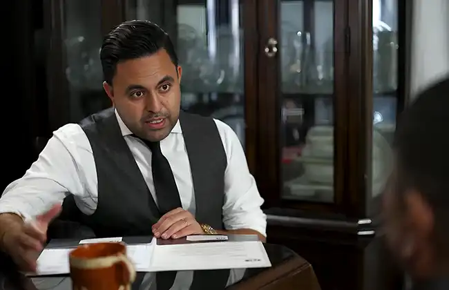 AK lawyer talking to a Lyft accident victim during a consultation