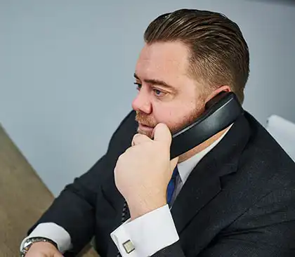 AK lawyer on the phone with a dog bite victim