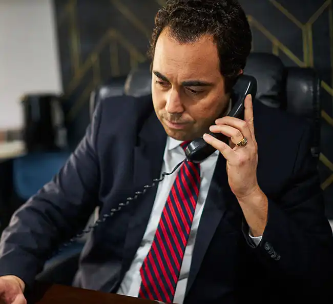 AK lawyer on the phone with a personal injury victim in Fontana