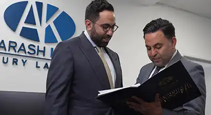 AK personal injury lawyers discussing a drive-thru accident case