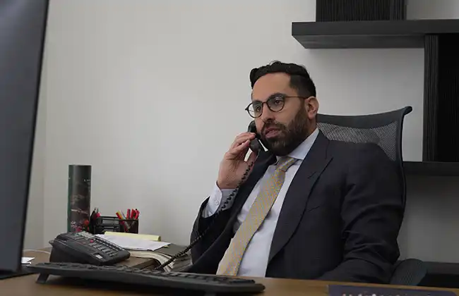 Elk Grove personal injury attorney speaking with a client over the phone during a legal consultation