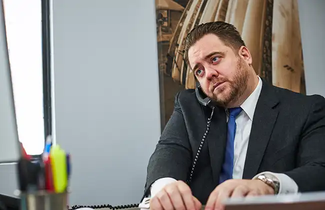 Fresno Dog Bite Lawyer speaking with a client over the phone