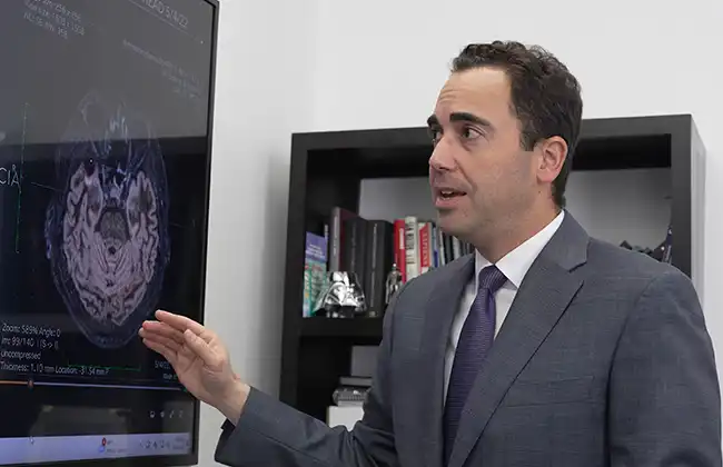 Hayward personal injury lawyer explaining a brain scan in a legal consultation