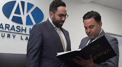 Two attorneys discussing a workplace injury claim