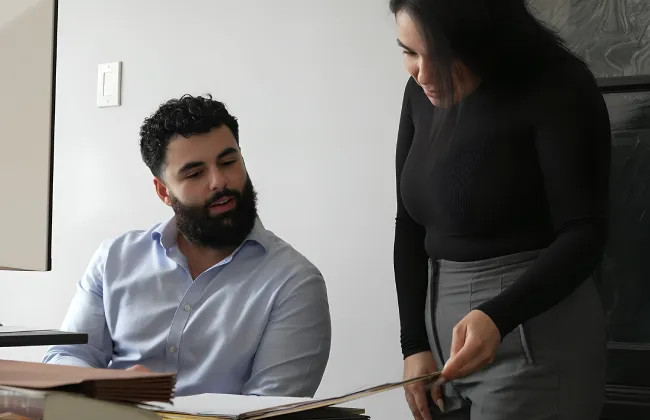 A personal injury attorneys reviewing a client’s case file