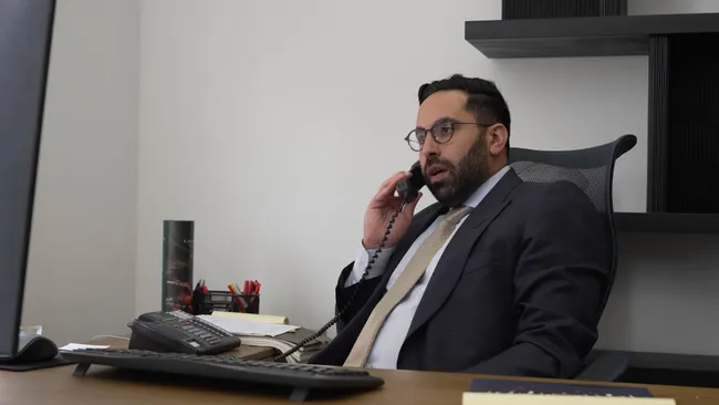 AK lawyer speaking on the phone with a Lyft accident victim in Salinas