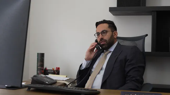 AK lawyer speaking on the phone with a car accident victim in Palmdale