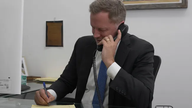 AK lawyer talking to a client about an Airbnb accident case