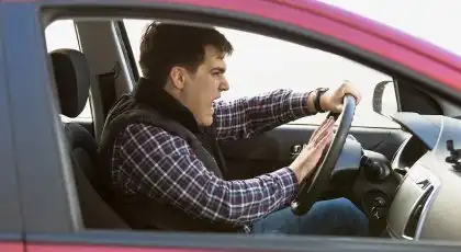 Frustrated driver aggressively pressing the car horn