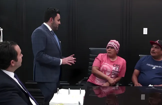 Rideshare accident lawyers discussing a case with injured clients