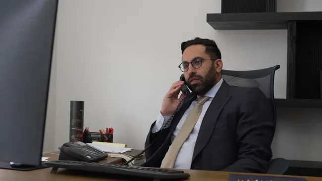 AK lawyer speaking on the phone with a client involved in a Lyft accident in Oxnard