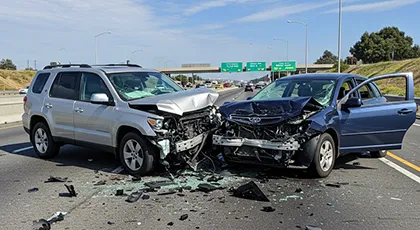 Head-on car crash illustrating shared driver liability in personal injury cases
