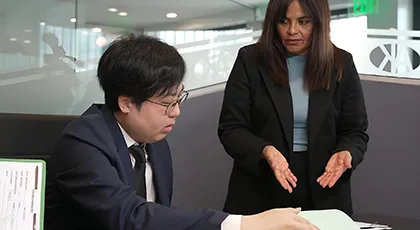 Legal team discussing details of a rear-end crash case