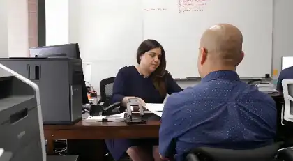 Attorney meeting with car accident victim to discuss towing and storage fee claims