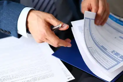 Accident lawyer reviewing insurance claim documents after a crash