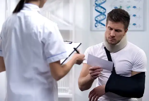 injured man looking at his hospital bills