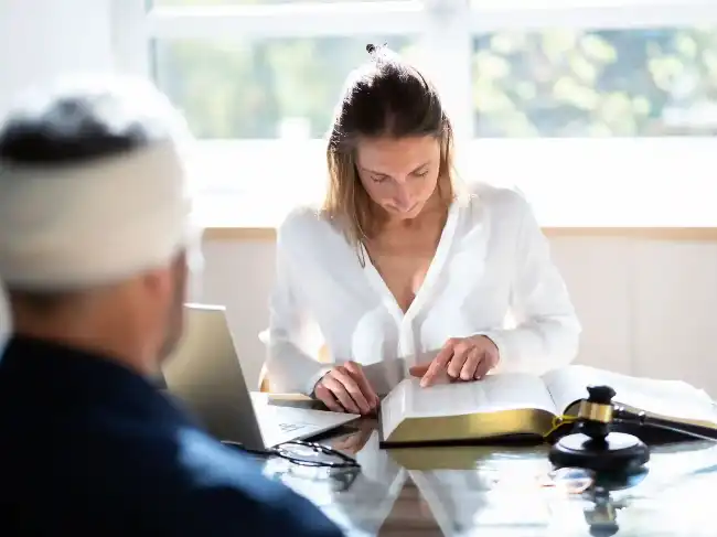Car accident victim discussing case with lawyer