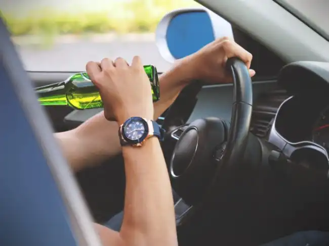 DUI accident risk with driver drinking alcohol while driving in Fresno