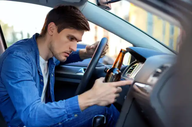 DUI accident risks with driver drinking alcohol while driving