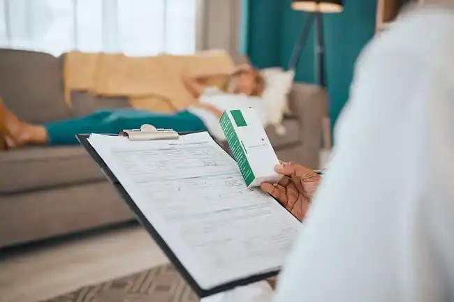 Doctor of personal injuries victim checking list of medicine