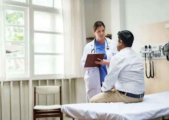 Doctor speaking with DUI accident victim