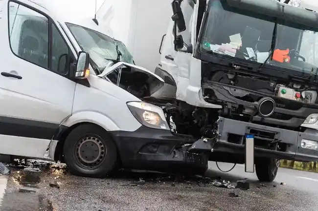 Front of car wrecked after an accident with truck
