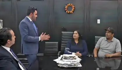 Lawyer consulting clients about car wash damage dispute