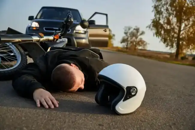 Motorcycle accident victim lying on the ground