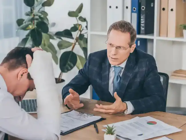 Personal injury lawyer discussing case with client