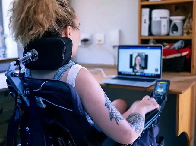 Personal injury victim using a high-tech wheelchair after suffering serious accident-related injuries