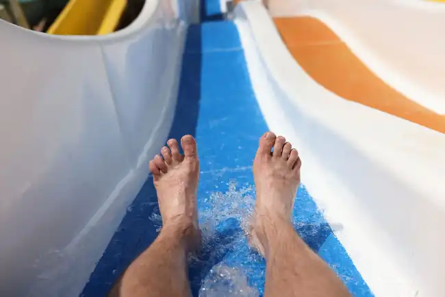 man going down the water slide