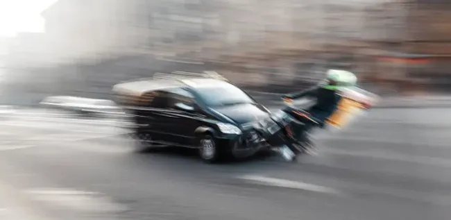 A car driving too fast collided with a motorcycle causing a speeding-related accident