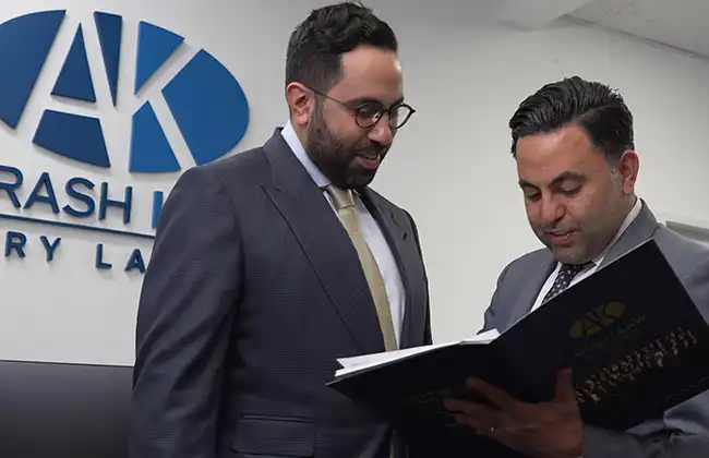 AK Law attorneys reviewing documents for car accident cases in Fontana